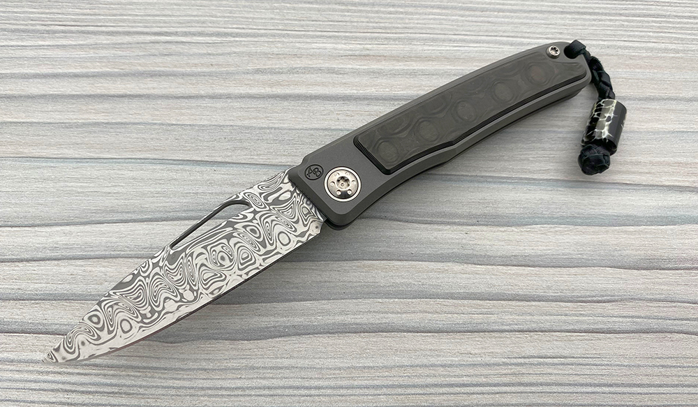 Rinkhals Damasteel Rose in Uniblack Carbon Fiber African Sporting